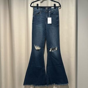 Brand new high rise Sneak Peek flair jeans.